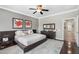 Stylish bedroom with modern furniture, dark wood accents, and decorative wall art at 5123 W Redbird Rd, Phoenix, AZ 85083
