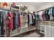 Spacious closet with extensive storage, including shelves, rods, and drawers for organization at 5123 W Redbird Rd, Phoenix, AZ 85083