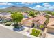 Charming home exterior featuring a well-manicured lawn, desert landscaping, and a welcoming facade at 5123 W Redbird Rd, Phoenix, AZ 85083