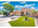 Charming single-story home featuring a well-manicured lawn, desert landscaping, and a two-car garage in a desirable location at 5123 W Redbird Rd, Phoenix, AZ 85083