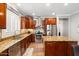 Bright kitchen with stainless appliances, center island and cherry cabinets at 5123 W Redbird Rd, Phoenix, AZ 85083