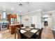 Open kitchen with stainless steel appliances, granite countertops, island and table with seating for four at 5123 W Redbird Rd, Phoenix, AZ 85083