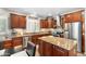 Updated kitchen offers a center island, mosaic backsplash, and stainless steel appliances at 5123 W Redbird Rd, Phoenix, AZ 85083