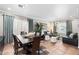 Spacious living area with an open floor plan including a dining room and stylish furnishings, perfect for entertaining at 5123 W Redbird Rd, Phoenix, AZ 85083