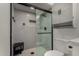 Updated shower area with shower seat, subway tile, and modern glass doors at 5216 E Half Moon Dr, Phoenix, AZ 85044
