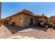 Backyard view of a stucco home with a patio and solar panels at 5216 E Half Moon Dr, Phoenix, AZ 85044