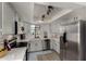 Bright updated kitchen featuring stainless appliances, gray cabinets, and modern lighting at 5216 E Half Moon Dr, Phoenix, AZ 85044