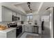 Modern kitchen featuring stainless appliances, light gray cabinets, and updated lighting at 5216 E Half Moon Dr, Phoenix, AZ 85044