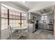 Bright kitchen features a breakfast nook with bay window and gray cabinets at 5216 E Half Moon Dr, Phoenix, AZ 85044