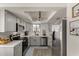 Updated kitchen with stainless steel appliances, gray cabinets, and subway tile backsplash at 5216 E Half Moon Dr, Phoenix, AZ 85044
