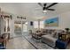 Comfortable living room with a gray sectional, natural light, and access to the backyard at 5216 E Half Moon Dr, Phoenix, AZ 85044