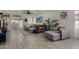 Inviting living room featuring a cozy sectional, light floors, and access to the outdoors at 5216 E Half Moon Dr, Phoenix, AZ 85044