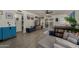 Open-concept living room with light floors, a gray sectional, and bright natural light at 5216 E Half Moon Dr, Phoenix, AZ 85044