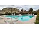 Community pool features lounge chairs, shaded seating and desert landscaping at 5216 E Half Moon Dr, Phoenix, AZ 85044