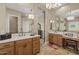 Bathroom featuring tile floors, double sinks, chandelier, and makeup vanity at 5258 S Verde --, Mesa, AZ 85212