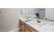 Bathroom featuring double sinks with white countertops and blue decorative towels and flowers at 5258 S Verde --, Mesa, AZ 85212