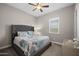 Cozy bedroom featuring a ceiling fan and a patterned quilt on the bed at 5258 S Verde --, Mesa, AZ 85212