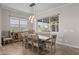 Bright dining room with modern lighting, a wooden dining table and lots of natural light at 5258 S Verde --, Mesa, AZ 85212