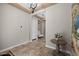 Foyer featuring tiled floors, an ornate table, and an open archway to the other rooms at 5258 S Verde --, Mesa, AZ 85212