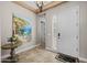 The foyer features tiled floors, a decorative table, and an artistic painting on the wall at 5258 S Verde --, Mesa, AZ 85212
