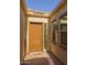 Inviting front entryway with a solid wood door, sidelight windows and brick walkway at 5258 S Verde --, Mesa, AZ 85212