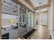 The home's hallway with tiled floor leads to the outdoor patio through sliding glass doors at 5258 S Verde --, Mesa, AZ 85212