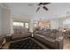 Spacious living room featuring tile floors, modern furniture, and plenty of natural light at 5258 S Verde --, Mesa, AZ 85212