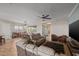 Open-concept living room featuring tile floors, a ceiling fan, and lots of natural light at 5258 S Verde --, Mesa, AZ 85212