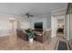 Inviting living room featuring tile floors, a ceiling fan, and comfortable seating at 5258 S Verde --, Mesa, AZ 85212