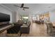 Open-concept living room featuring tile floors, a ceiling fan, and lots of natural light at 5258 S Verde --, Mesa, AZ 85212