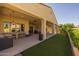 Inviting covered patio with bar seating and outdoor ceiling fans, perfect for entertaining in your own backyard at 5258 S Verde --, Mesa, AZ 85212