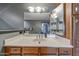 Bathroom with large vanity, sink, wood cabinets, and ample lighting at 5303 N 7Th St # 331, Phoenix, AZ 85014