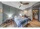Inviting bedroom featuring a ceiling fan, closet, study space, and comfortable bed at 5303 N 7Th St # 331, Phoenix, AZ 85014