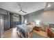 Comfortable bedroom with ceiling fan, and private balcony access at 5303 N 7Th St # 331, Phoenix, AZ 85014