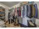 Organized walk-in closet with shelving, hanging rods, and ample storage for clothing and personal items at 5303 N 7Th St # 331, Phoenix, AZ 85014