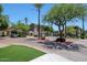Community entrance featuring landscaping, signage, and gated access at 5303 N 7Th St # 331, Phoenix, AZ 85014