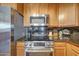 Modern kitchen appliances including stainless steel microwave, stove, and granite countertops at 5303 N 7Th St # 331, Phoenix, AZ 85014