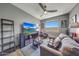 Cozy living room featuring a ceiling fan, a TV, comfortable seating, and natural light from the window at 5303 N 7Th St # 331, Phoenix, AZ 85014