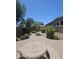 Relaxing backyard with stone table, lush landscaping and mature trees at 549 E Benrich Dr, Gilbert, AZ 85295
