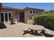 Relaxing backyard with stone table, fountain and mature landscaping at 549 E Benrich Dr, Gilbert, AZ 85295