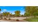 Community basketball court surrounded by lush landscaping, perfect for outdoor activities at 549 E Benrich Dr, Gilbert, AZ 85295
