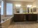 Bathroom featuring dual sinks and a tub at 549 E Benrich Dr, Gilbert, AZ 85295