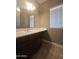 Bathroom featuring a spacious vanity sink, neutral-toned walls, a large mirror, and a clean, modern aesthetic at 549 E Benrich Dr, Gilbert, AZ 85295