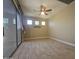 Bedroom featuring tile floors, neutral walls, ceiling fan, and sliding glass door at 549 E Benrich Dr, Gilbert, AZ 85295