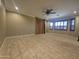 Spacious bedroom features tile flooring and shutters at 549 E Benrich Dr, Gilbert, AZ 85295