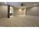 Spacious bedroom with tile flooring and a ceiling fan at 549 E Benrich Dr, Gilbert, AZ 85295