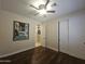 Bedroom featuring hardwood floors and closet doors at 549 E Benrich Dr, Gilbert, AZ 85295