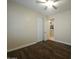 Bedroom with wood floors, closet, and neutral paint at 549 E Benrich Dr, Gilbert, AZ 85295