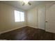 Bedroom features a window, ceiling fan, and closet at 549 E Benrich Dr, Gilbert, AZ 85295