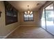 Dining room with tiled floor, chandelier and sliding glass door leading to patio at 549 E Benrich Dr, Gilbert, AZ 85295